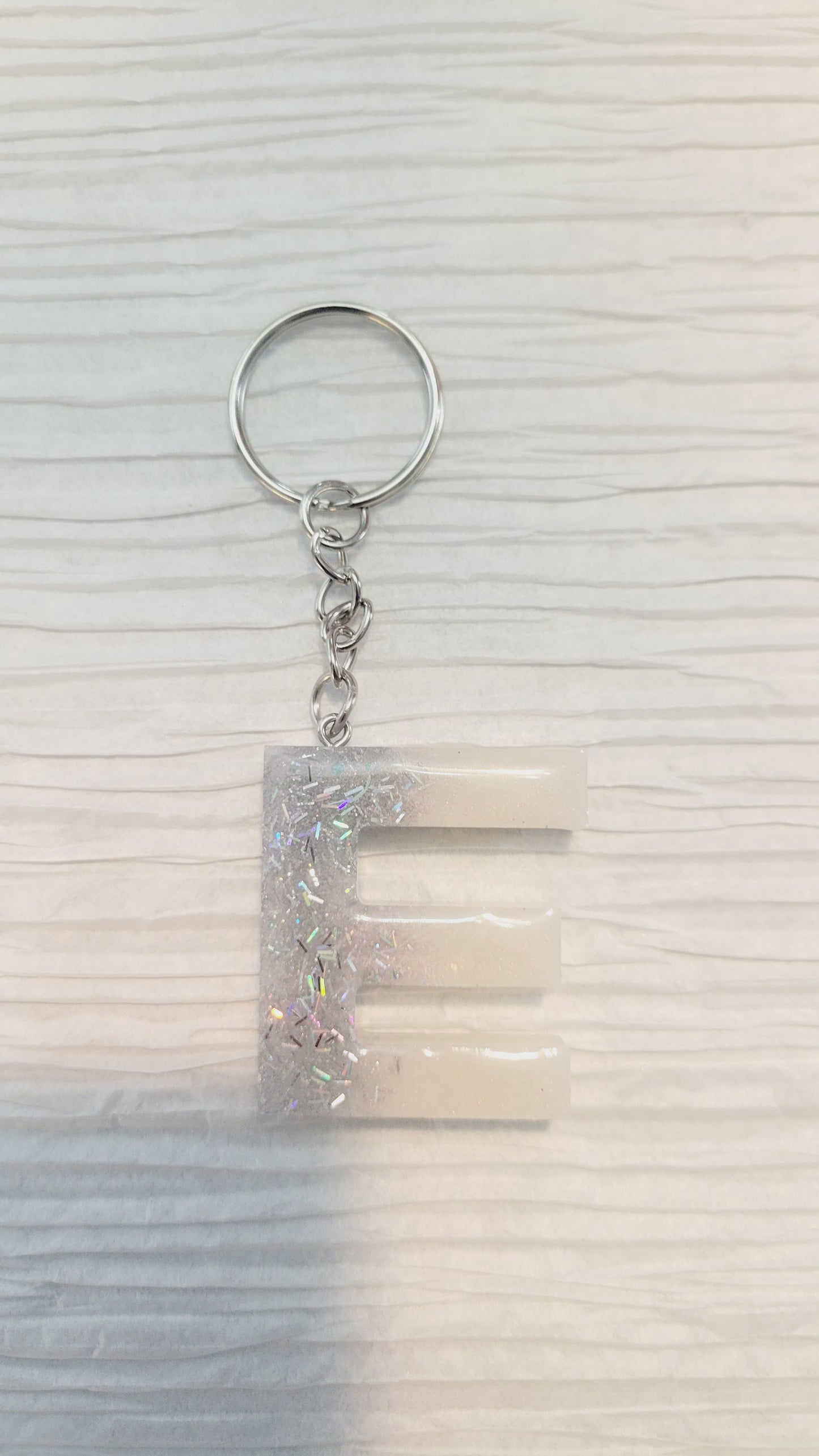Silver strand & iridescent white letter Keychain