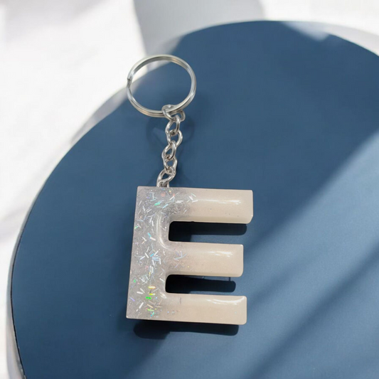 Silver strand & iridescent white  letter Keychain